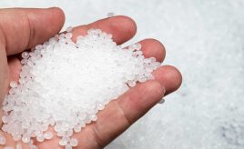 hand holding while polypropylene resin